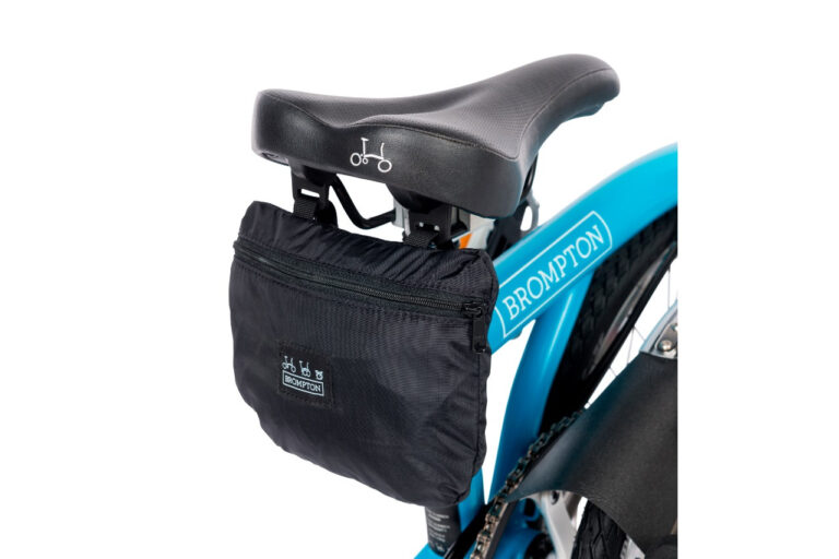 Niebieski Pokrowiec Brompton - Pokrowiec na rower Transit z torbą mocowaną do siedzenia.