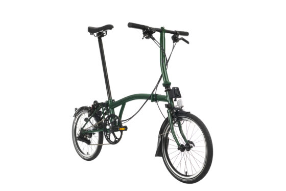 Zielony składany rower Brompton C-line Explore Yuzu Lime z czarnymi siedzeniami i kierownicą, pokazany na białym tle.